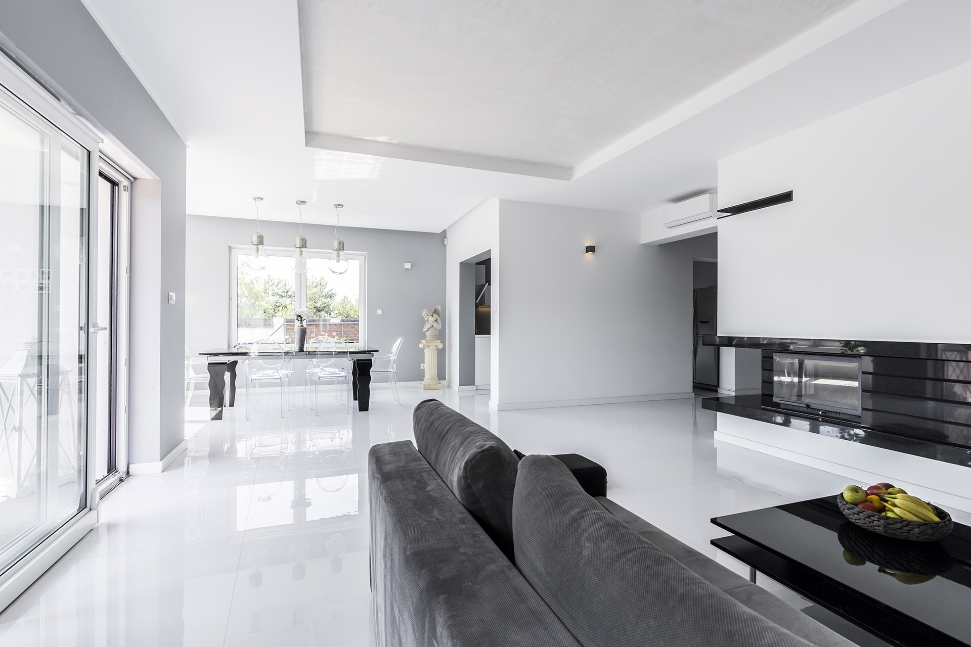 spacious living room with grey couch spacious living room with grey couch